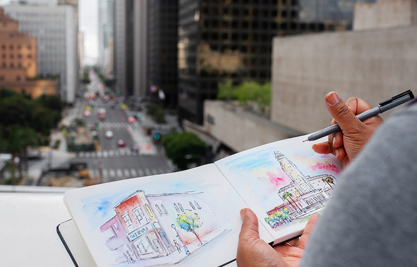 sketchbook con ilustraciones arquitectónicas realizadas desde una vista urbana